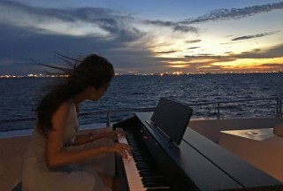 Pianovers Sailaway Pre-Event Shoot, Sueli playing against the sunset