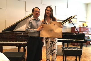 Celine Goh, General Manager of Steinway Gallery Singapore, with Professor Yu Chun Yee