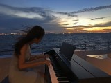 Pianovers Sailaway Pre-Event Shoot, Sueli playing against the sunset