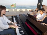 Pianovers Sailaway 2016, Junn, Gregory, and Julia playing the piano on the flybridge