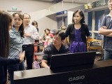 Pianovers Meetup #22, Gee Yong at the piano, with others around